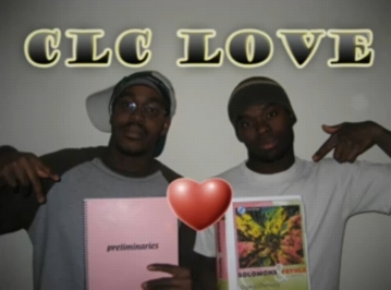 Two students pointing to organic text books with a heart in the center.  Click on the image to run audio clip.